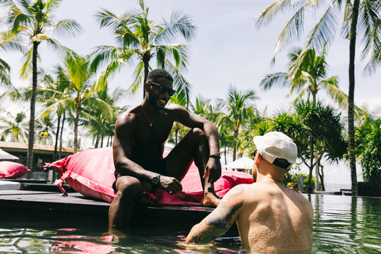 Two Guys on Vacation Talking to Each Other