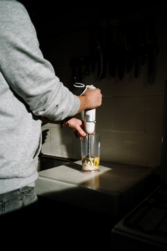 Man Making Mayonaise With A Hand Blender