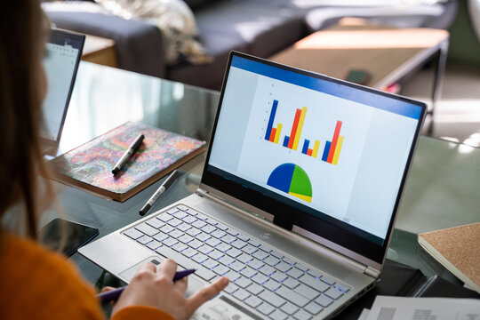Young woman working from home in living room