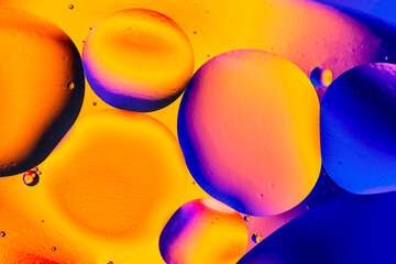 Abstract colorful background with oil on water surface. Oil drops in water abstract psychedelic....