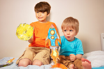 Two boys play astronauts and rocker liftoff