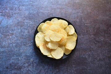 Obraz na płótnie Canvas Crispy corrugated potato chips snack food