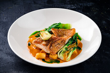 Snapper fish steak in white plate