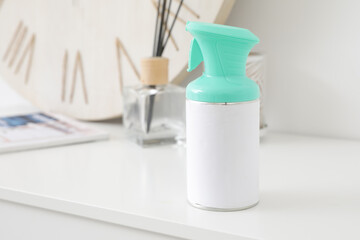 Bottle of air freshener on shelf in room, closeup
