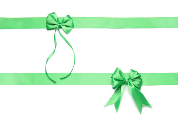 Beautiful green ribbons with bows on white background