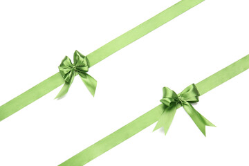 Beautiful green ribbons with bows on white background