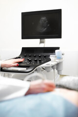 medical examining pregnant belly by ultrasonic scan