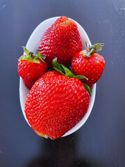 strawberry in a white glass bowl 