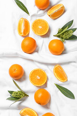 Juicy oranges on fabric background