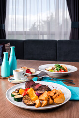 Sliced medium rare grilled Steak Ribeye with french fries