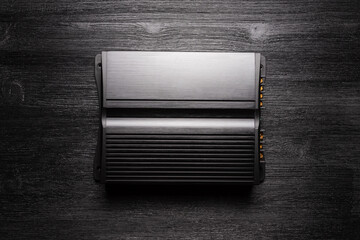 Car audio amplifier flat lay background.