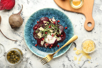Composition with delicious beetroot carpaccio on grunge background