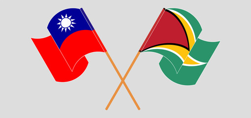 Crossed and waving flags of Taiwan and Guyana
