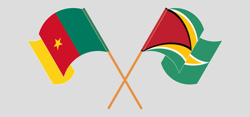 Crossed and waving flags of Cameroon and Guyana