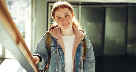 Happy young woman in college