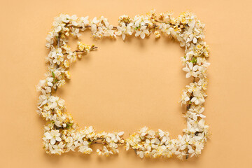 Obraz premium Frame made of beautiful blooming branches on color background