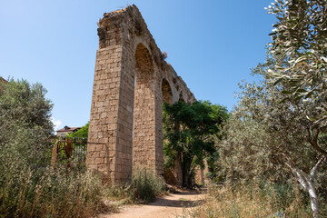 Fototapeta na wymiar The 200 year old Ottoman aqueduct, supplied water from Cabri springs to Akko, western Galilee, Israel. Ruins of the Turkish aqueduct in the Mazraa, Arabic village.