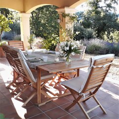 table and chairs on terrace in the morning sun