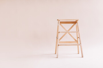 New wooden ladder on the white background. isolated stepladder. Space for text