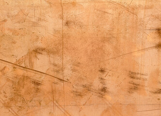 Texture of an old, dirty, heavily scratched and stained copper sheet as a background