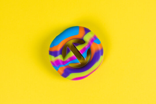 Anti-stress toy snapperz on yellow background, copy space. Expander emits click. Concept trendy entertainment for fidget children, sensory toys, development of fine motor skills, stress relieving