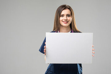 young doctor woman showing blank billboard on white background