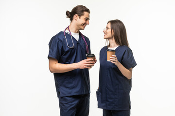 two medics drink coffee isolated on white background