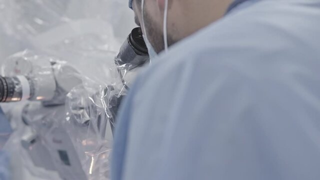 Modern surgical operating room. Surgeons team performing operation in surgery room.  
Close-up Shot in the Operating Room. brain surgery