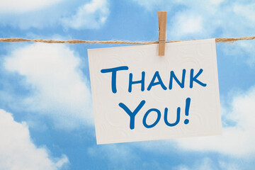 Thank you white greeting card over blue sky © Karen Roach