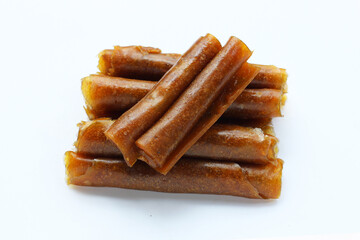 Dried mango paste on white background.