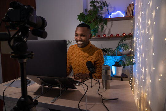 Man Smiling While Recording Podcast