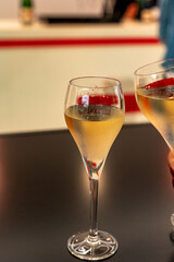 Tasting of cold brut Champagne sparkling wine  in underground cellars of wine house in Reims, Champagne, France