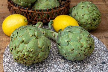 Fresh ripe green artichokes heads ready to cook