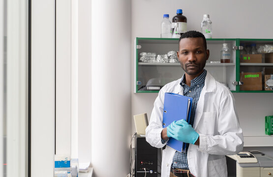 Scientist Holding Folder