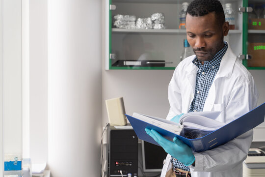 Scientist Analysing Data From Folder