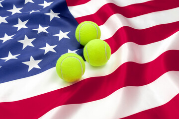 THREE TENNIS BALLS ON THE AMERICAN FLAG.
UNITED STATES TENNIS SUCCESS CONCEPT.