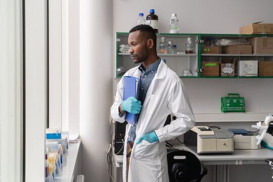 Scientist Looking Through The Window