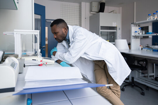 Scientist Monitoring Sample In Lab
