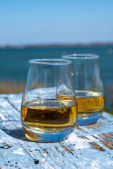 Tasting of single malt Scotch whisky with blue sea, ocean or river view, private whisky tours in Scotland, UK