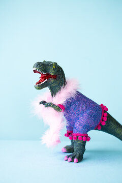 Toy dinosaur playing dress-up