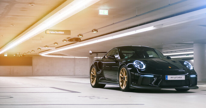 Arranged Street shot of an modern Porsche 911 GT3 RS racing sports car