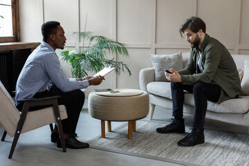 Psychotherapist asking questions to man 