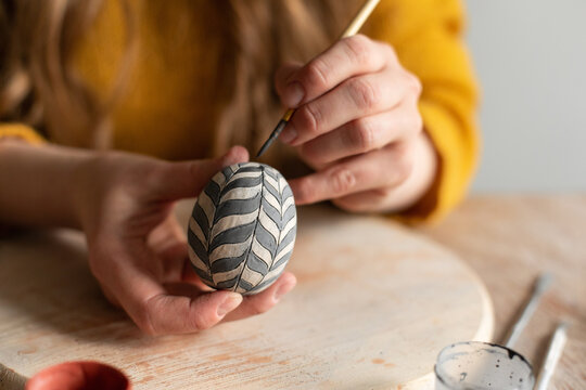 Handmade pottery egg with painting