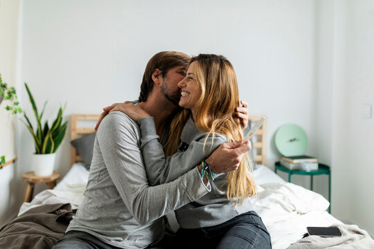 couple celebrating positive pregnancy test