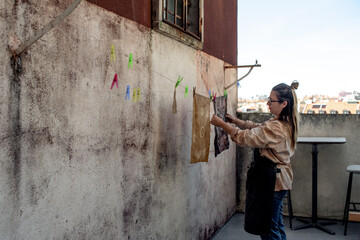 Designer hanging the printed textile