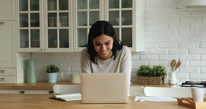 Pretty Korean woman read e-mail on laptop cant believe in luck, looking excited surprised, feels very happy. Student got university scholarship, pass admission, on-line auction, victory moment concept