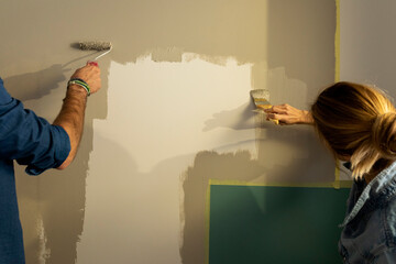 couple painting wall