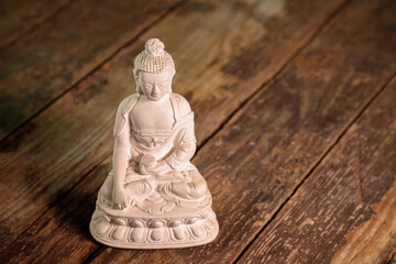 white figurine of the buddha of the fossil