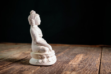 white figurine of the buddha of the fossil