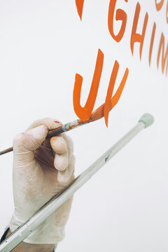 Street Artist Working In Studio On Typography